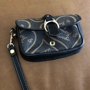Dooney & Bourke navy blue fabric wristlet about 8 inch and can hold an iPhone 8